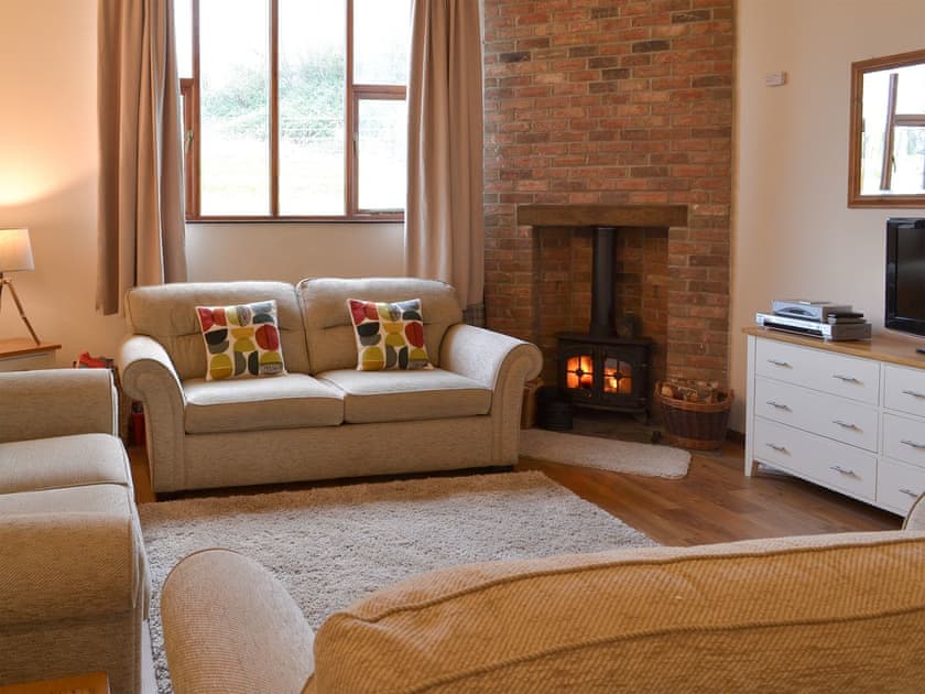 Living room with wood burner | Rook - Newhouse Barton, Ipplepen, near Totnes