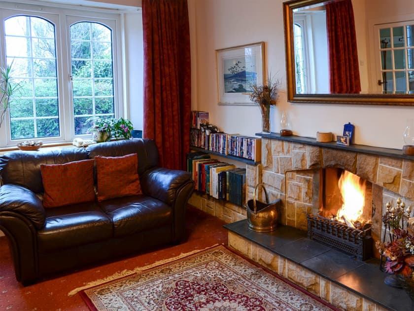 Comfortable living room with open fire | Culcharry Cottage, Cawdor, Nairn