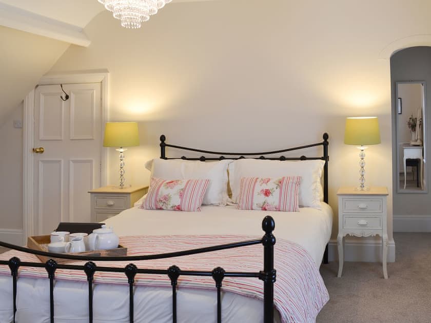 Double bedroom with antique style double bed | Princess Lodge, Scarborough