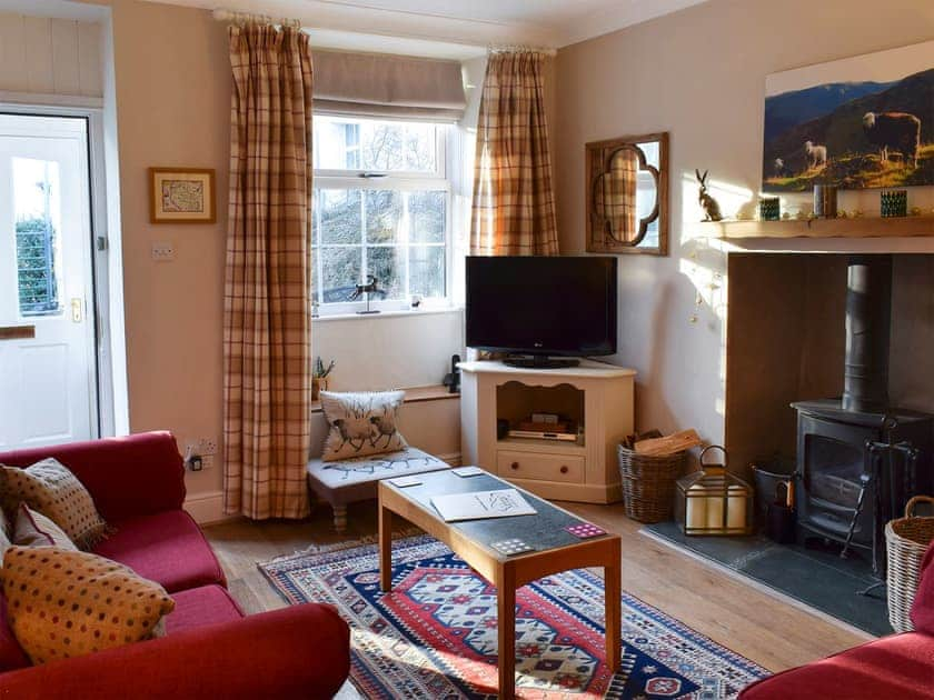 Cosy living area with wood burner | Herdwick Cottage, Troutbeck Bridge