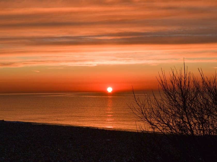 Spectacular sunset as seen from the bedroom window | Thalassa, Pagham, near Chichester