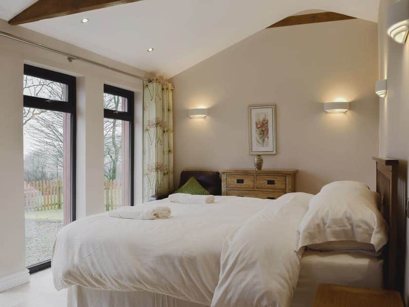 Lovingly furnished bedroom with large picture windows | Castle Farm - Castle Farm Cottages, Tufton, near Haverfordwest
