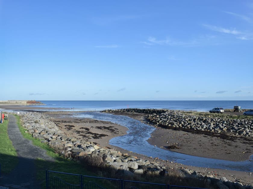 Far reaching views over Skinningrove Beck and out to sea from the bedroom | Mariner’s Cottage, Skinningrove, near Staithes