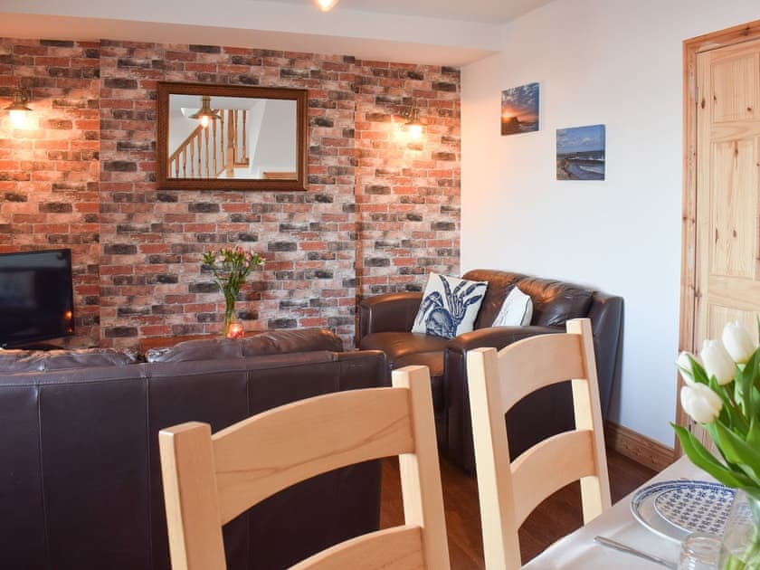 Comfortable and welcoming living/dining room | Mariner’s Cottage, Skinningrove, near Staithes