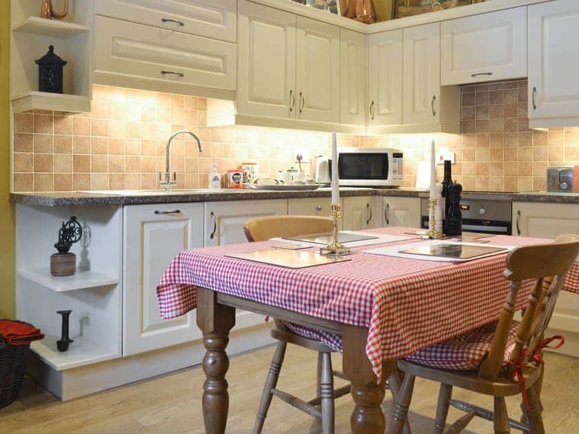 Fully appointed kitchen with convenient dining area | Old Barn Cottage, Lockton near Pickering