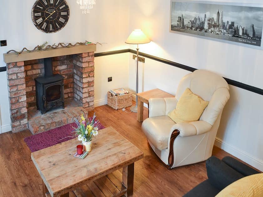 Living room with feature fireplace | Brewers Cottage, Cropton, near Pickering