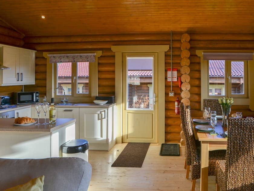 Kitchen and dining areas with door to the outside | Vindomora Country Lodges - Housesteads Lodge - Vindomora Country Lodges , Ebchester, near Consett