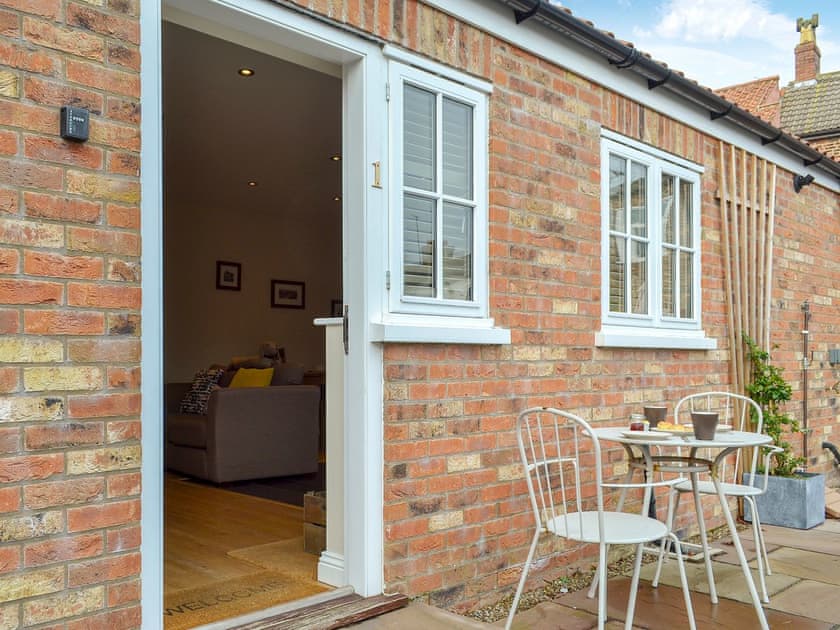 Sitting-out area with garden furniture  | 1 Croft Cottage - Croft Cottage Holidays, Stillington, near Easingwold