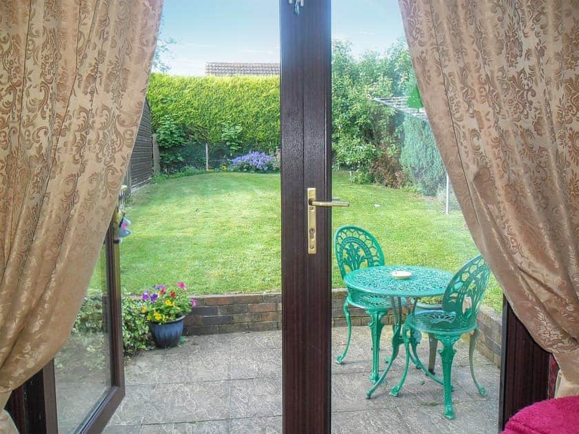 Enclosed, lawned garden with patio | White Cottage, Hemingby, near Horncastle