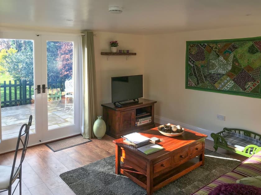 Living area with French doors to patio | Tiptoe, Steeple Ashton, near Trowbridge