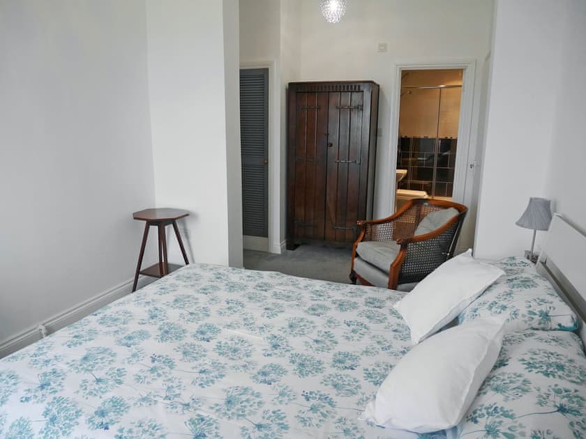 Spacious double bedroom with em-suite shower room | Lloyds Cottage, Portland, near Weymouth