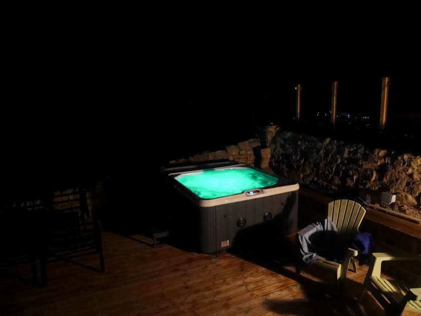 Inviting hot tub at night | Lloyds Cottage, Portland, near Weymouth