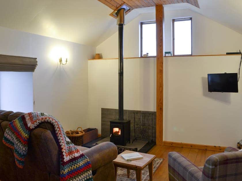 Living room with wood burner | Tawmans, Kilmuir, Isle of Skye