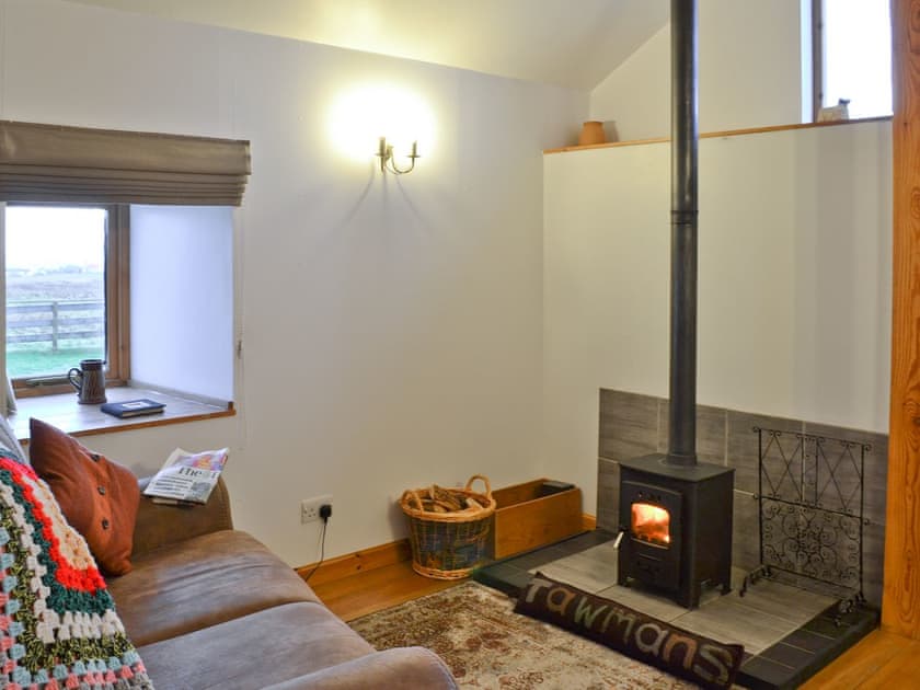 Living room with wood burner | Tawmans, Kilmuir, Isle of Skye