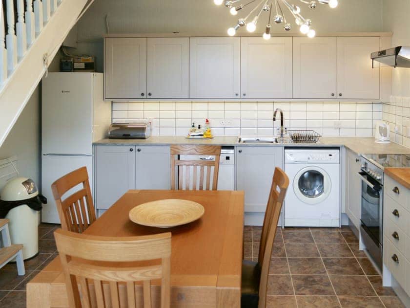 Convenient dining area within kitchen | Winville Cottage, Askrigg