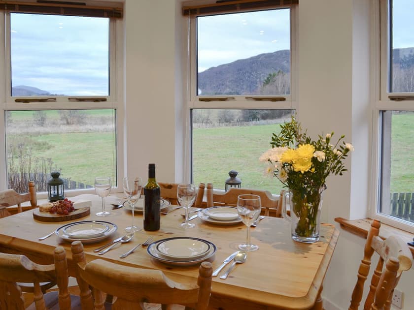 Light and airy dining area in the sun room | Birch Tree Cottage, Aviemore, Speyside