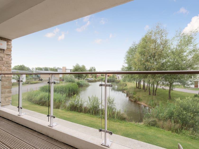 Balcony with lake view  | Chestnut Lodge, Somerford Keynes
