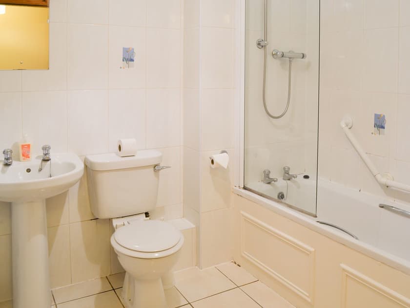 Bathroom with shower over the bath | Glen Apartment, Aviemore