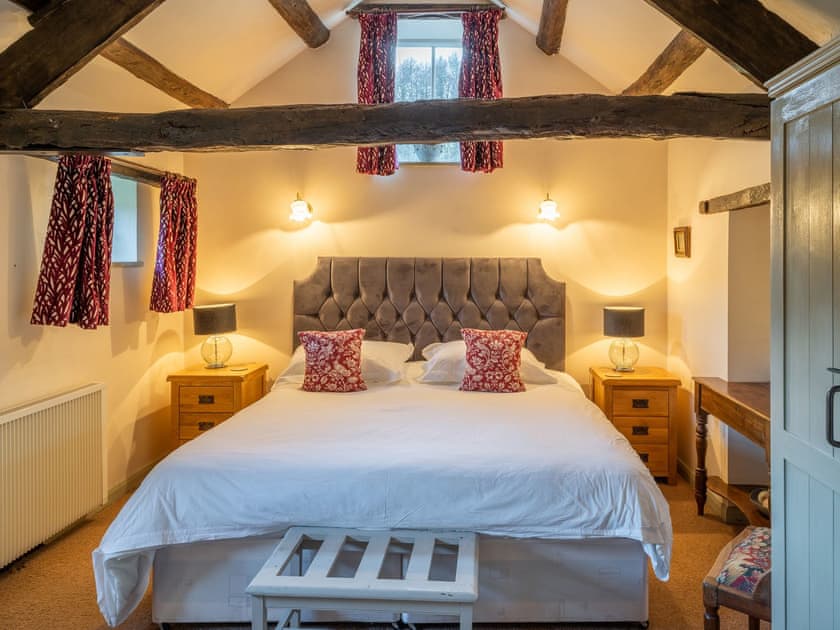 Peaceful double bedroom with exposed wood beams | Foxglove Cottage - Laskill Grange, Bilsdale, near Helmsley