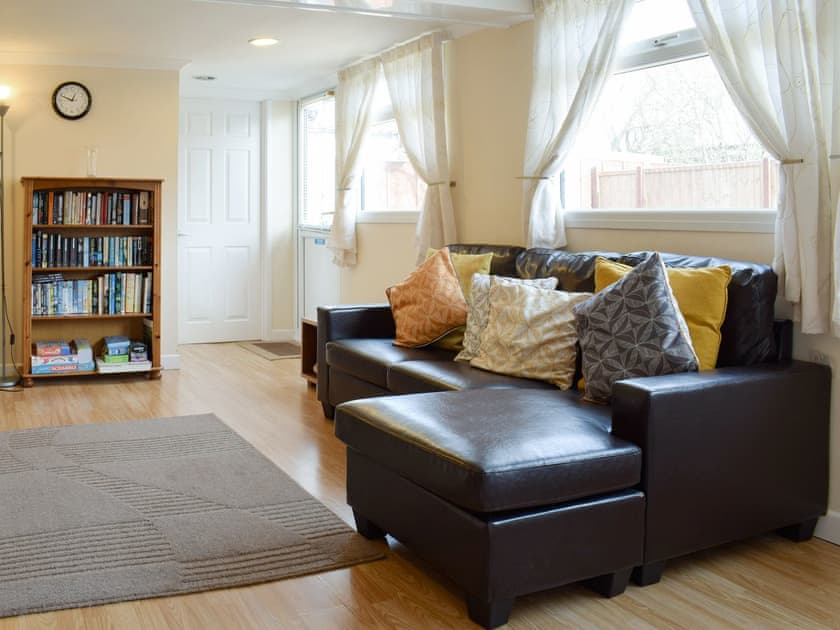Comfy seating within living area | Woodland Lodge, Rustington, near Littlehampton