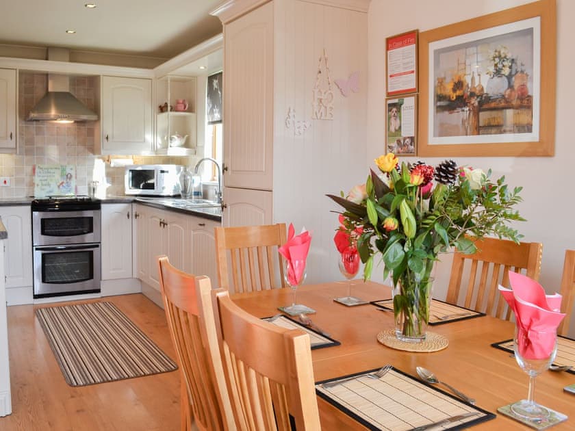 Dining table and chairs through to the kitchen | Yorkshire Rose Holiday Lodge, Sewerby, near Bridlington
