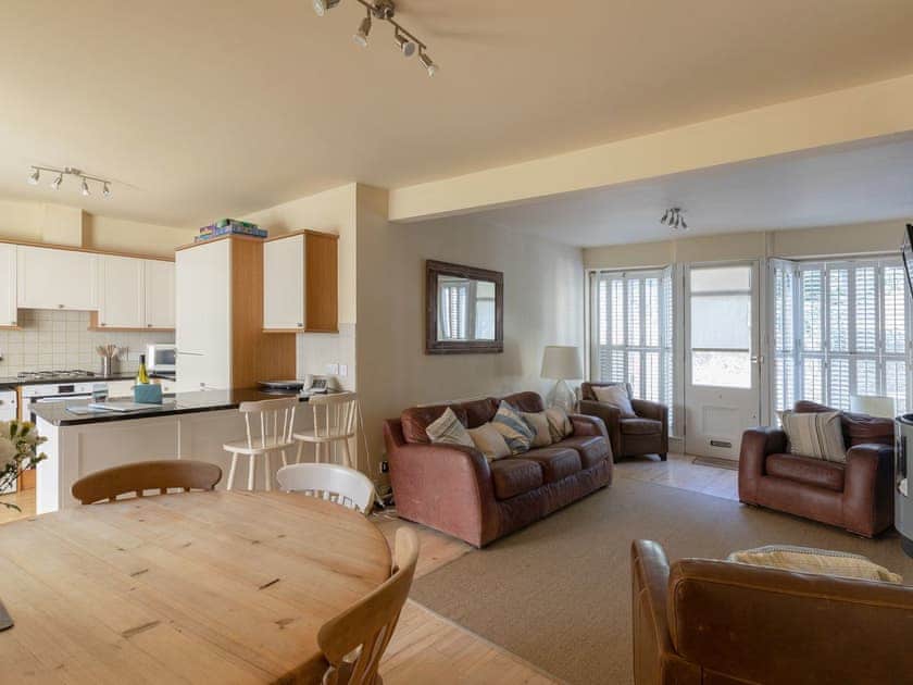 Spacious open plan kitchen, sitting and dining room with ’junkers’ stripped wooden floor throughout | Lower Marcam, Salcombe