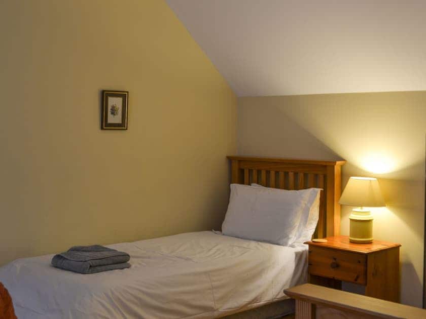 Double bedroom with additional bed | Woodland Lodge, Boat of Garten, near Aviemore