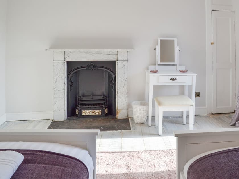 Twin bedroom with original fireplace | West House Farm, Muston, near Filey