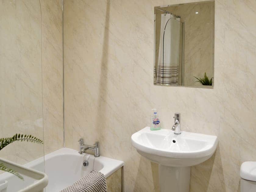 Family bathroom with shower over bath | The Sandpiper, Beadnell