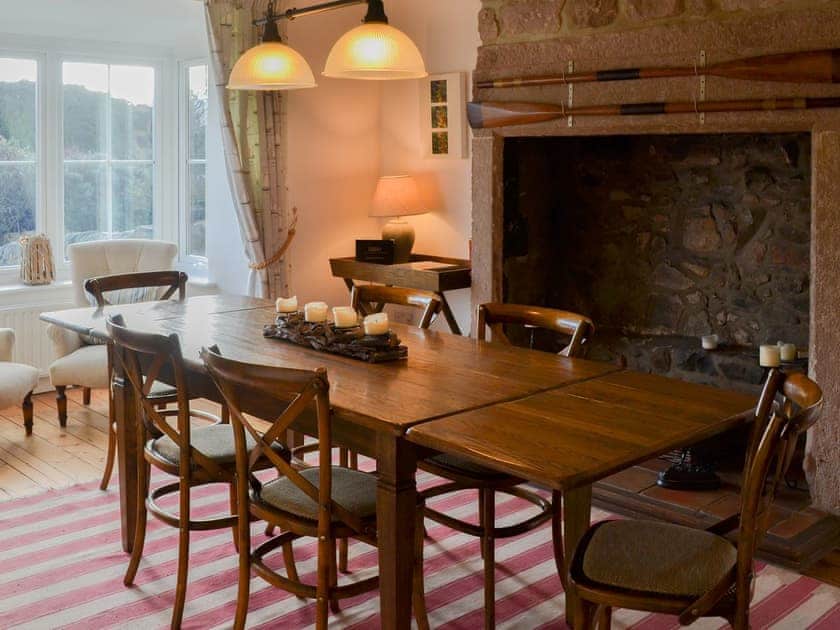Lovely dining room with large open fireplace | Harbourway, Craster