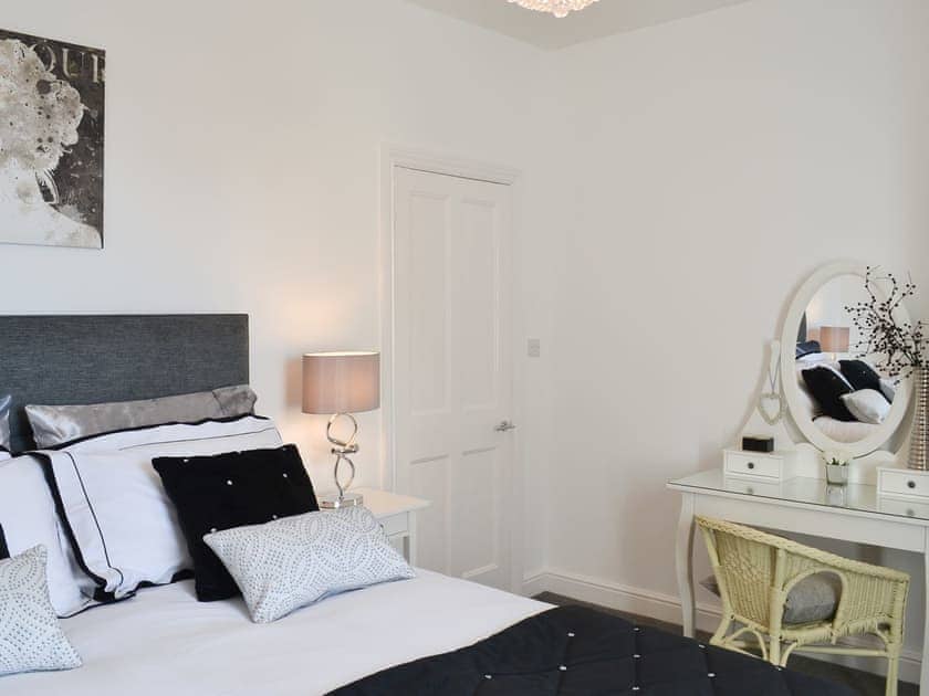 Lovely bedroom with attractive dressing area | Lobster Pot Cottage, Scarborough