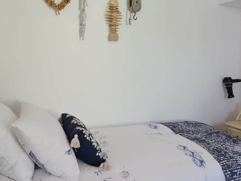 Comfortable bedroom with twin beds | Lobster Pot Cottage, Scarborough