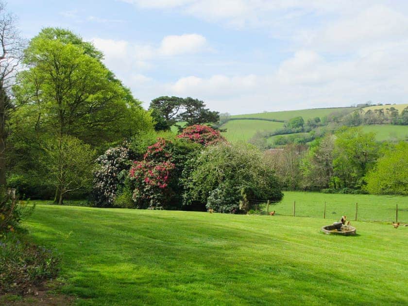 View from Tristan’s of south facing garden and across the Fowey valley | Tristan’s, Isolda’s - Lanwithan Manor Apartments, Lostwithiel