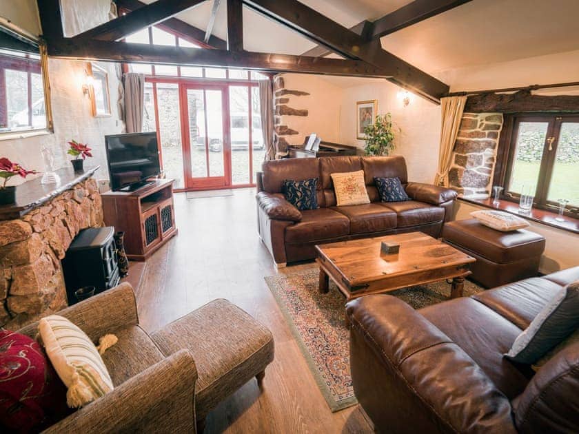 Large open plan living space with exposed wooden beams  | Wastwater Cottage - Bridge End Farm Cottages, Boot, near Eskdale