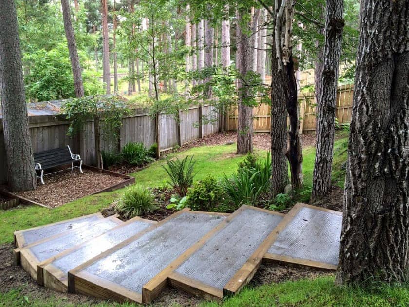 Lovely enclosed garden | Woodland Lodge, Boat of Garten, near Aviemore