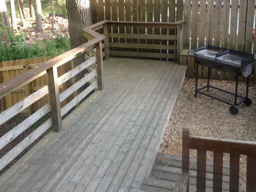 Decked area with BBQ | Woodland Lodge, Boat of Garten, near Aviemore
