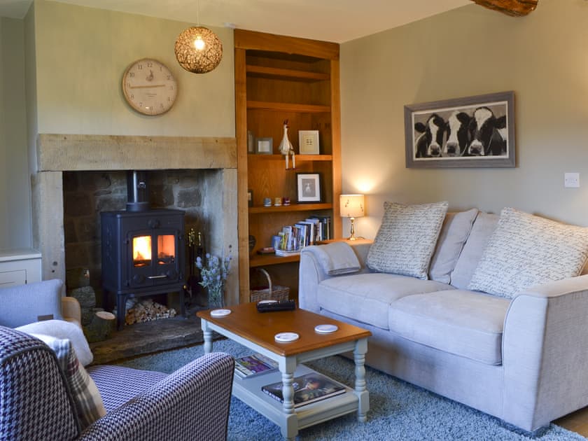Cosy living area with wood burner | Thistledown Cottage, Great Longstone, near Bakewell