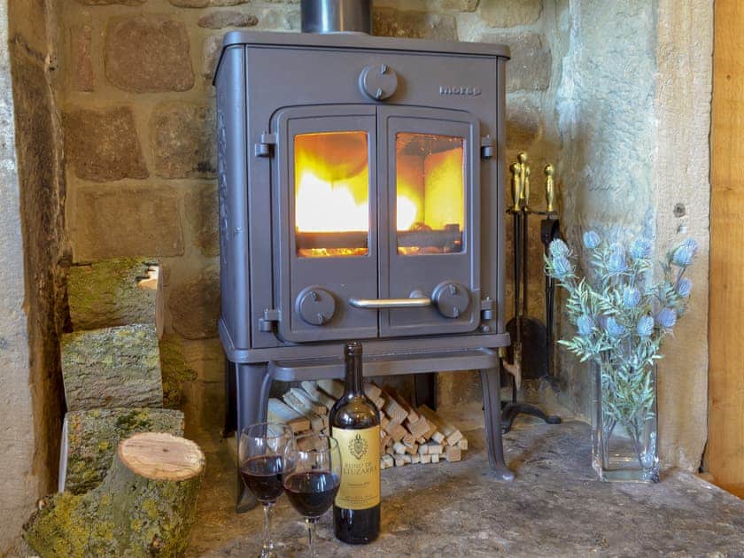 Cosy living area with wood burner | Thistledown Cottage, Great Longstone, near Bakewell