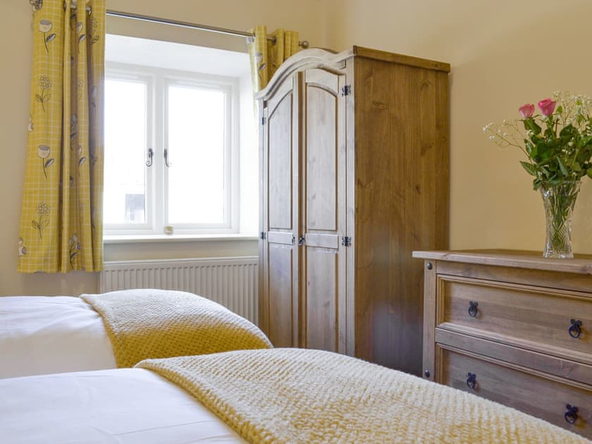 Ample storage within twin bedroom | Grange Cottage, Harome, near Helmsley