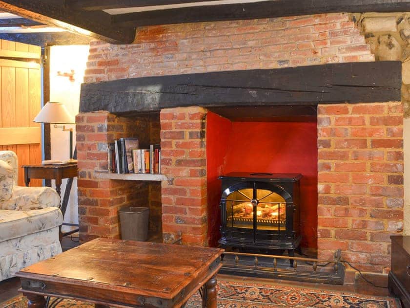 Cosy living room with feature fireplace | Tudor Cottage - Tudor Cottages, Romsey