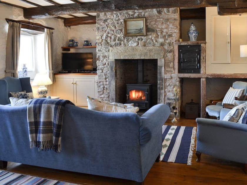 Cosy living room with wood burner | Branthwaite Stable - Branthwaite Cottages, Branthwaite, near Caldbeck