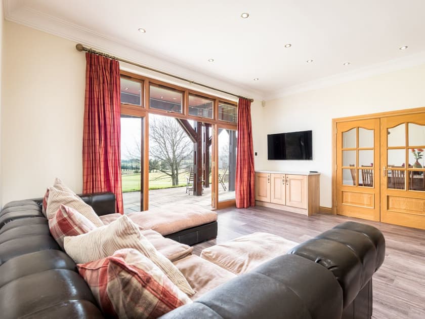 Living area with doors to the garden | Piperdam House, Piperdam, near Dundee