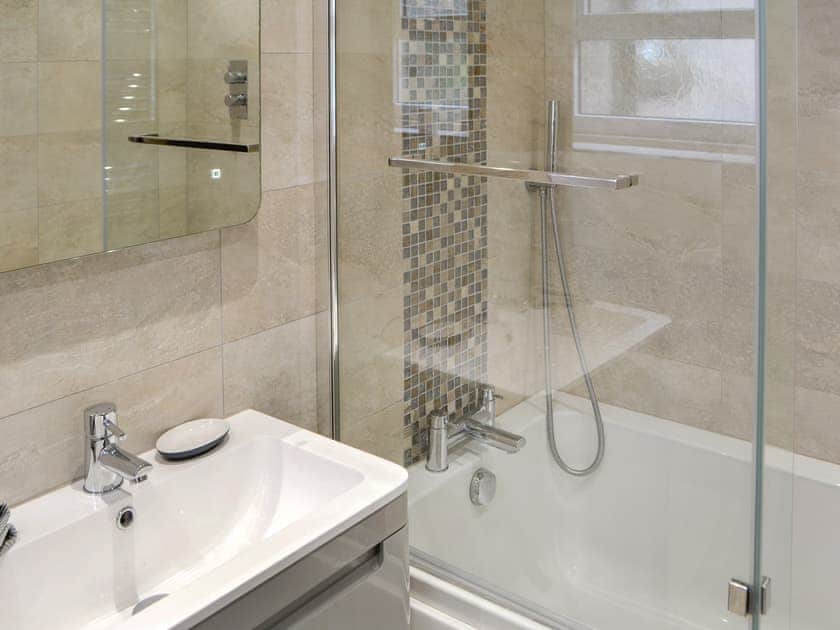 Family bathroom with shower over bath | The Old Telephone Exchange, Rothbury
