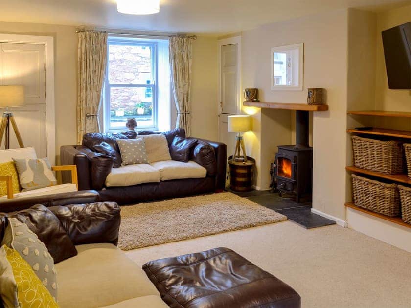 Comfortable living room with wood burner | Maggie’s Den, Gatehouse of Fleet