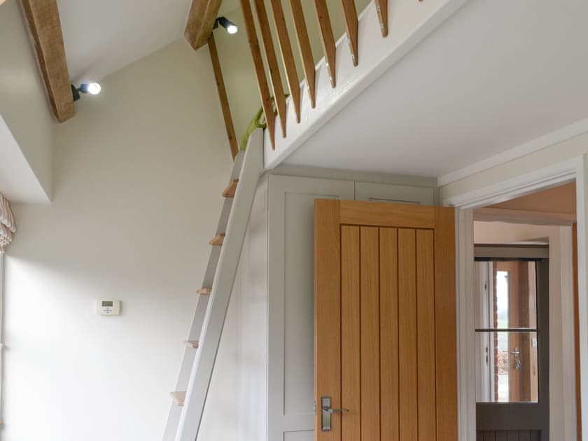 Steps from single bedroom to area with cabin bed | Trezeal Barn, North Hill