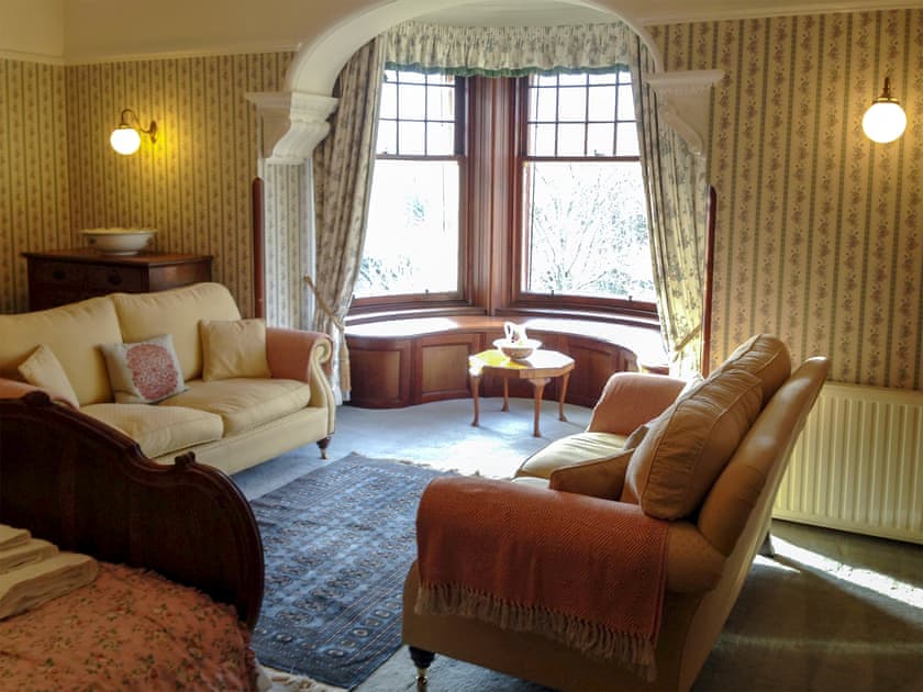 Double bedroom with feature fireplace and river views  | Dunvarlich House, Aberfeldy