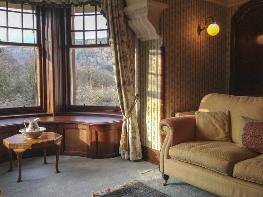 Double bedroom with feature fireplace and river views  | Dunvarlich House, Aberfeldy