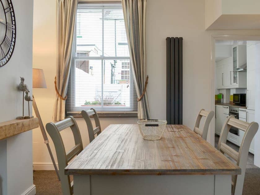 Dining room and adjacent living area | Lobster Pot Cottage, Scarborough