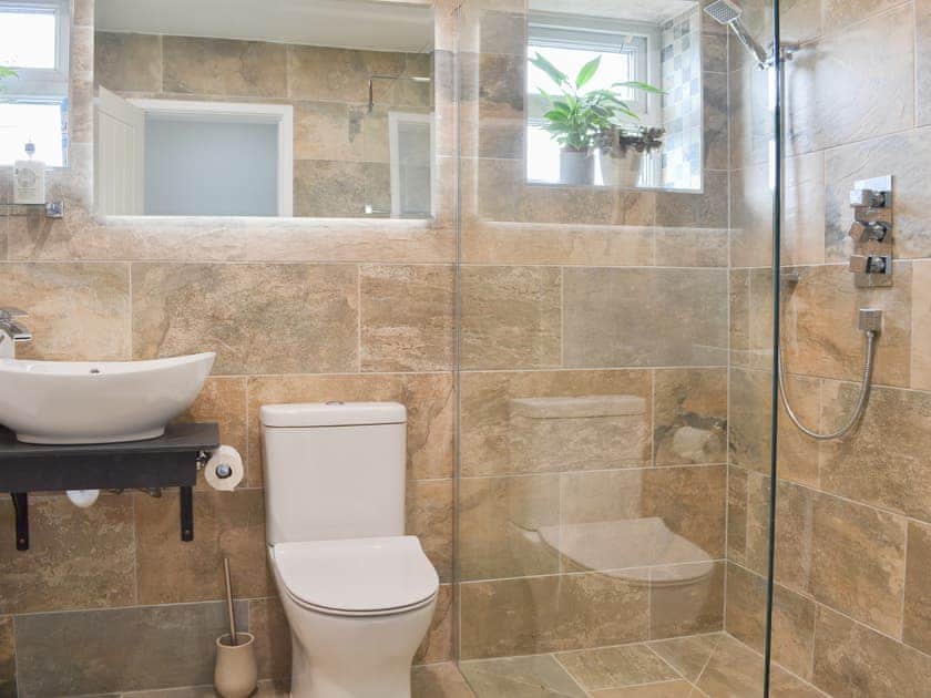 Bathroom with bath and shower  | Maes y Mor, Criccieth, near Porthmadog