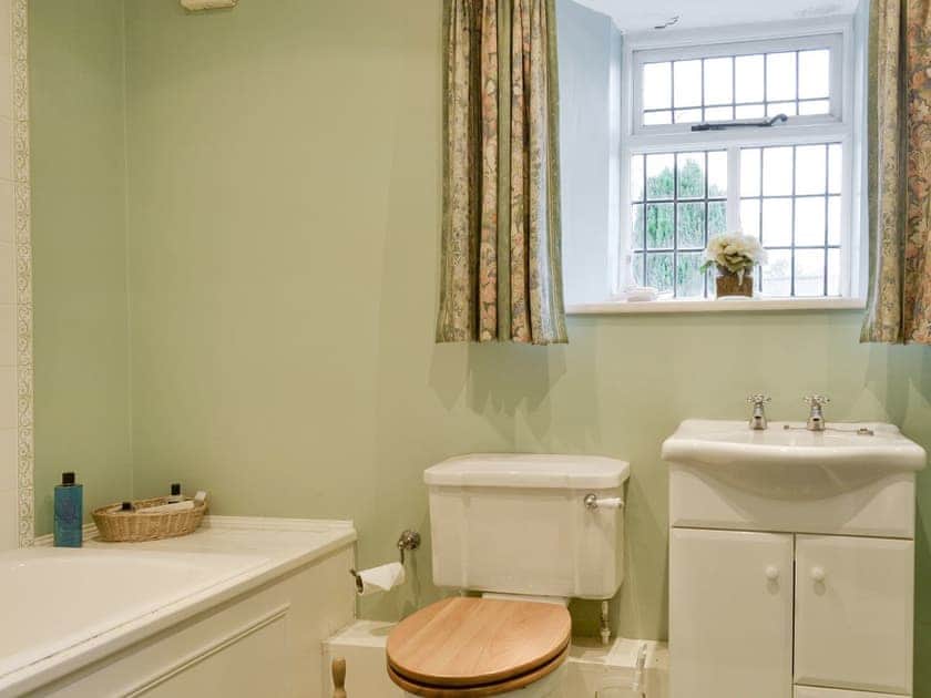 Family bathroom with shower over bath | The Dovecote, Harrogate